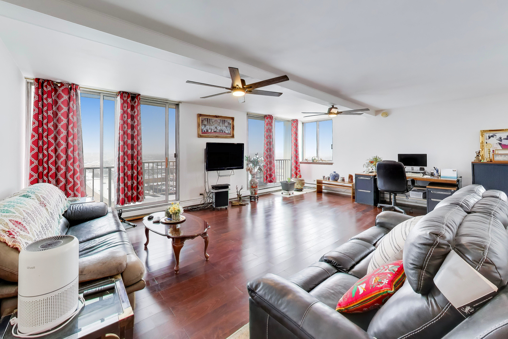 40 North Tower Road, Unit 16N Oak Brook, IL 60523 - Photo 4 of 31 a living room with furniture kitchen view and a flat screen tv