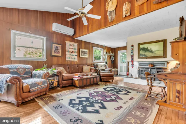 a living room with furniture or couch and a flat screen tv