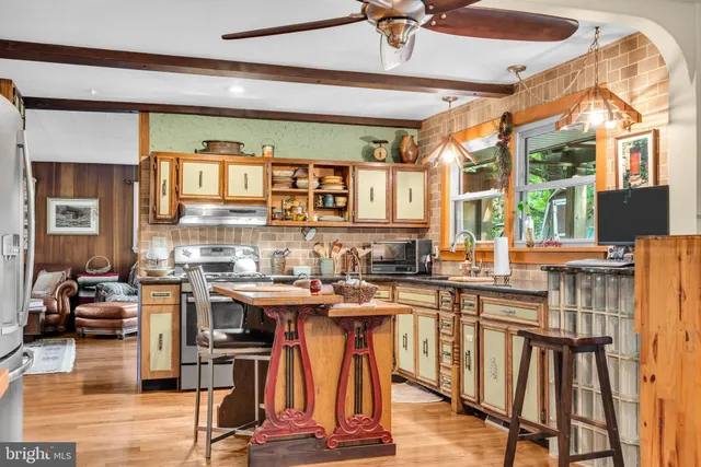 a kitchen with lots of counter top space and appliances