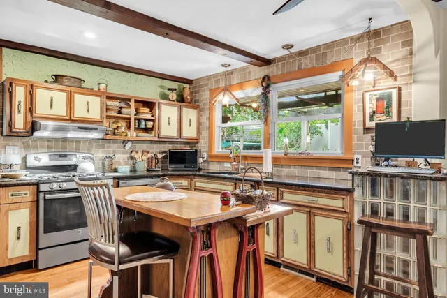 a kitchen with a sink and large window