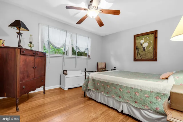 a bed room with a bed and a chandelier