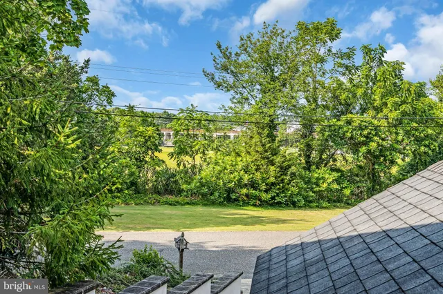 a view of swimming pool with a yard