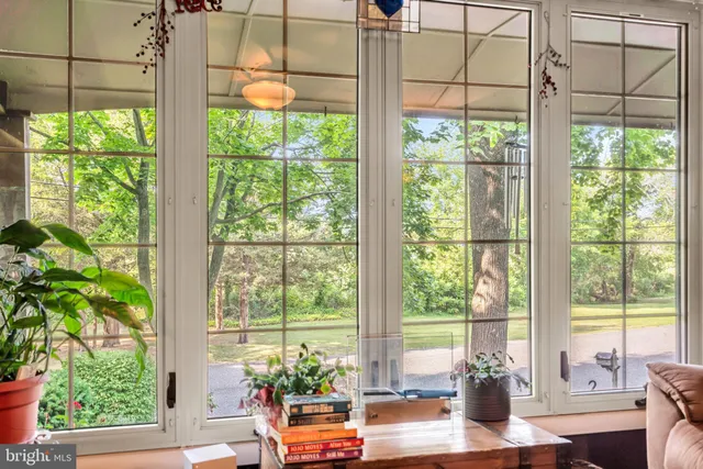 a living room with large windows