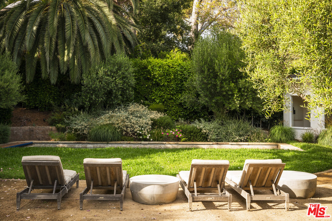 a view of a chairs and table in the yard