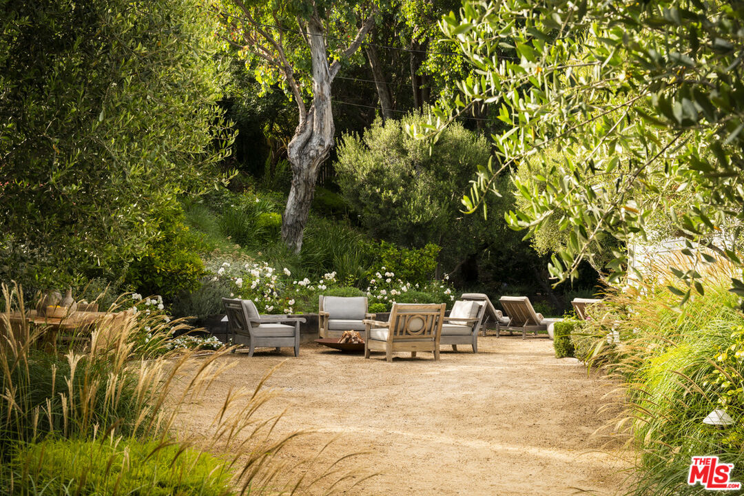 6456 Sycamore Meadows Drive Malibu, CA 90265 - Photo 30 of 34 a view of backyard with swimming pool and seating space