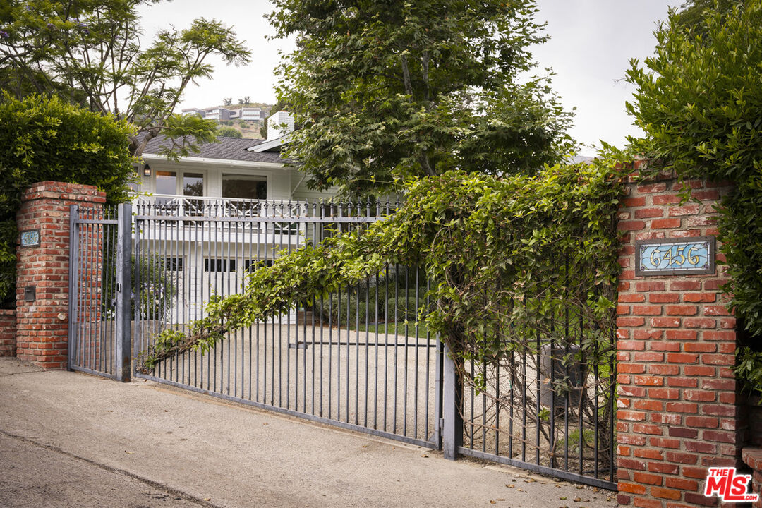 6456 Sycamore Meadows Drive Malibu, CA 90265 - Photo 5 of 34 a white house that has tree in front of it