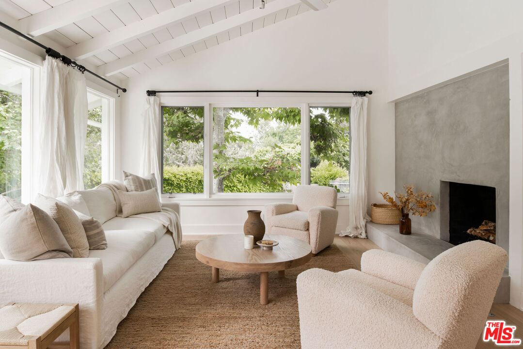 6456 Sycamore Meadows Drive Malibu, CA 90265 - Photo 9 of 34 a living room with furniture and a large window