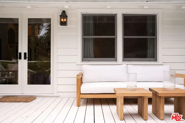 a view of a house with a window and wooden floor