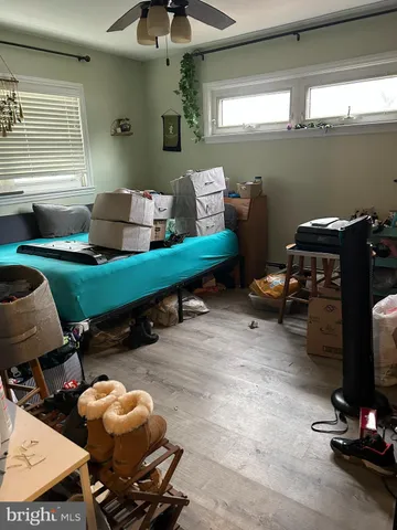 a gym room with furniture and a window