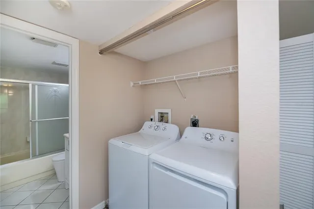 a utility room with dryer and washer