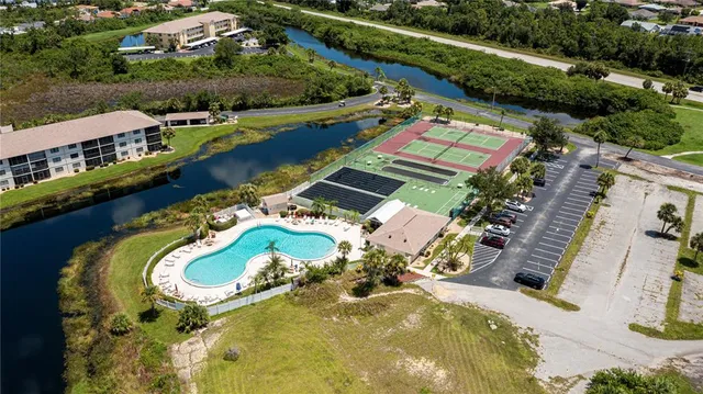 an aerial view of a house with a ocean view