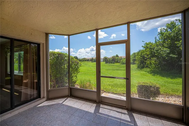 a view of an empty room with a large window