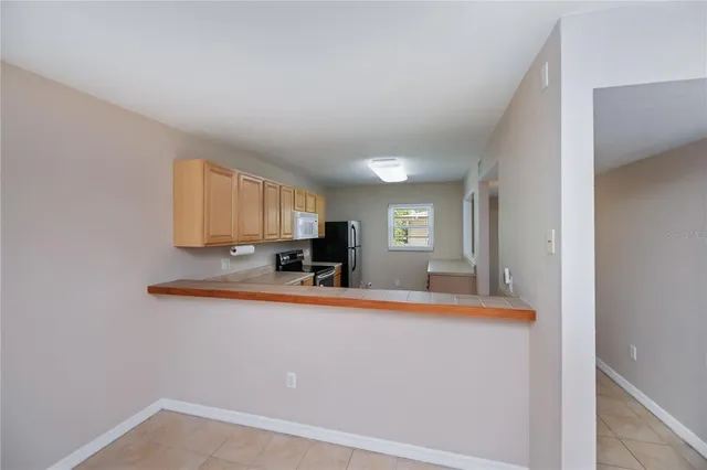 a view of kitchen with furniture and wooden floor