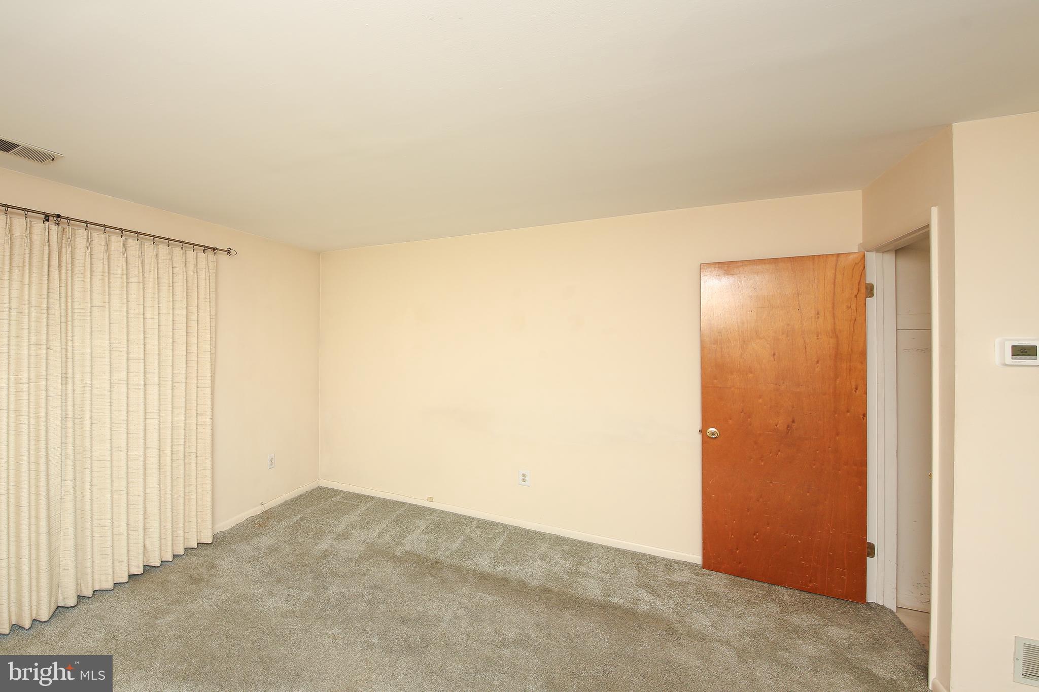 16 Ember Lane Horsham, PA 19044 - Photo 19 of 27 an empty room with a wooden door
