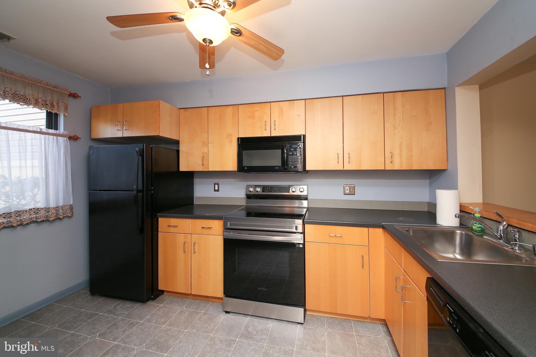 16 Ember Lane Horsham, PA 19044 - Photo 2 of 27 a kitchen with stainless steel appliances granite countertop a stove a refrigerator and a sink