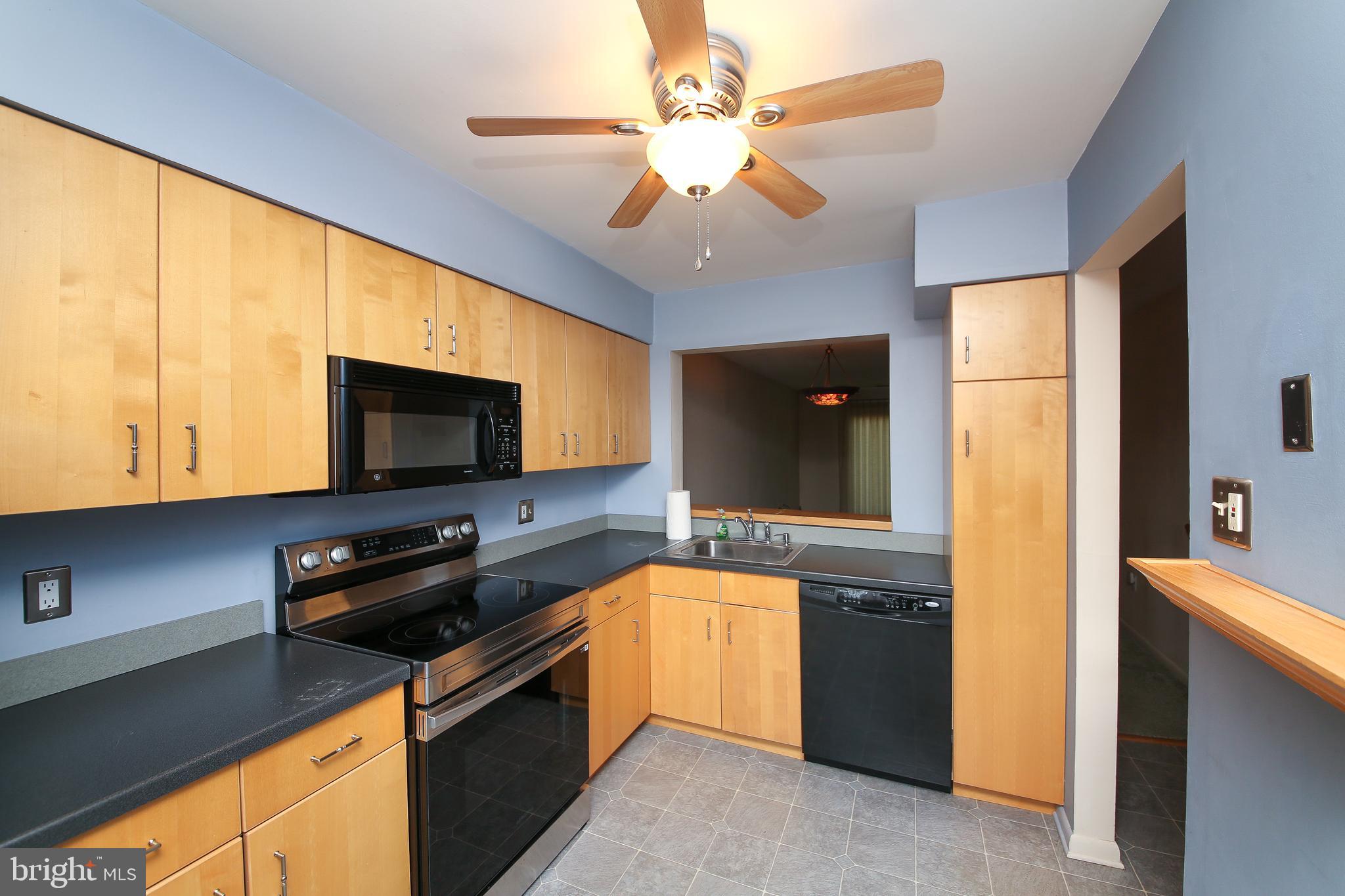 16 Ember Lane Horsham, PA 19044 - Photo 3 of 27 a kitchen with a stove a sink and a microwave