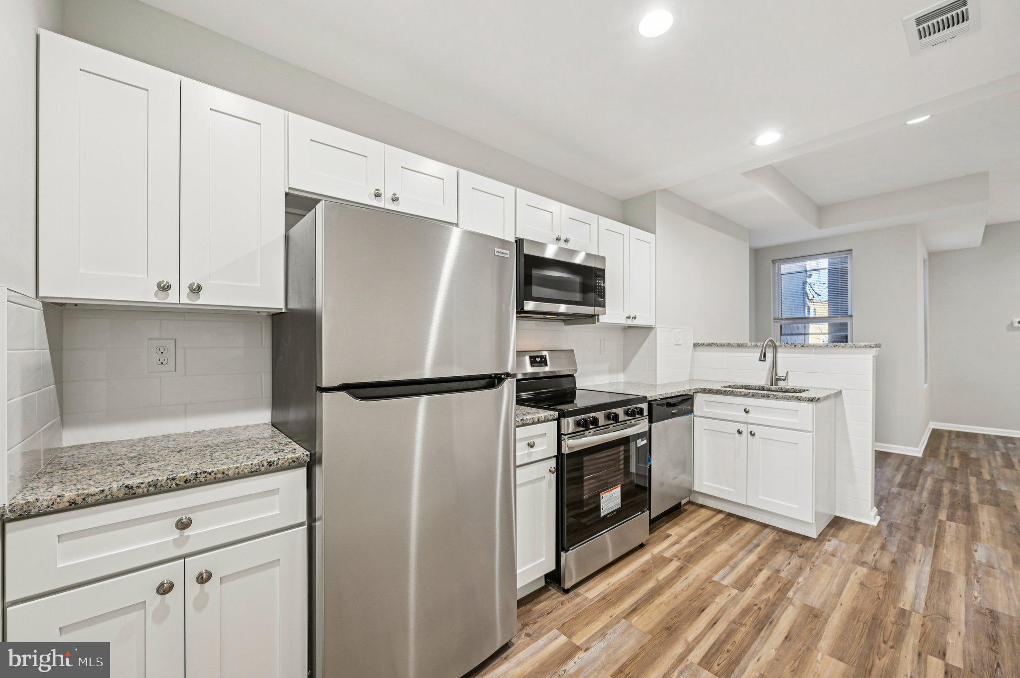 750 Reservoir Street, Unit B Baltimore, MD 21217 - Photo 13 of 25 a kitchen with cabinets appliances and a counter space