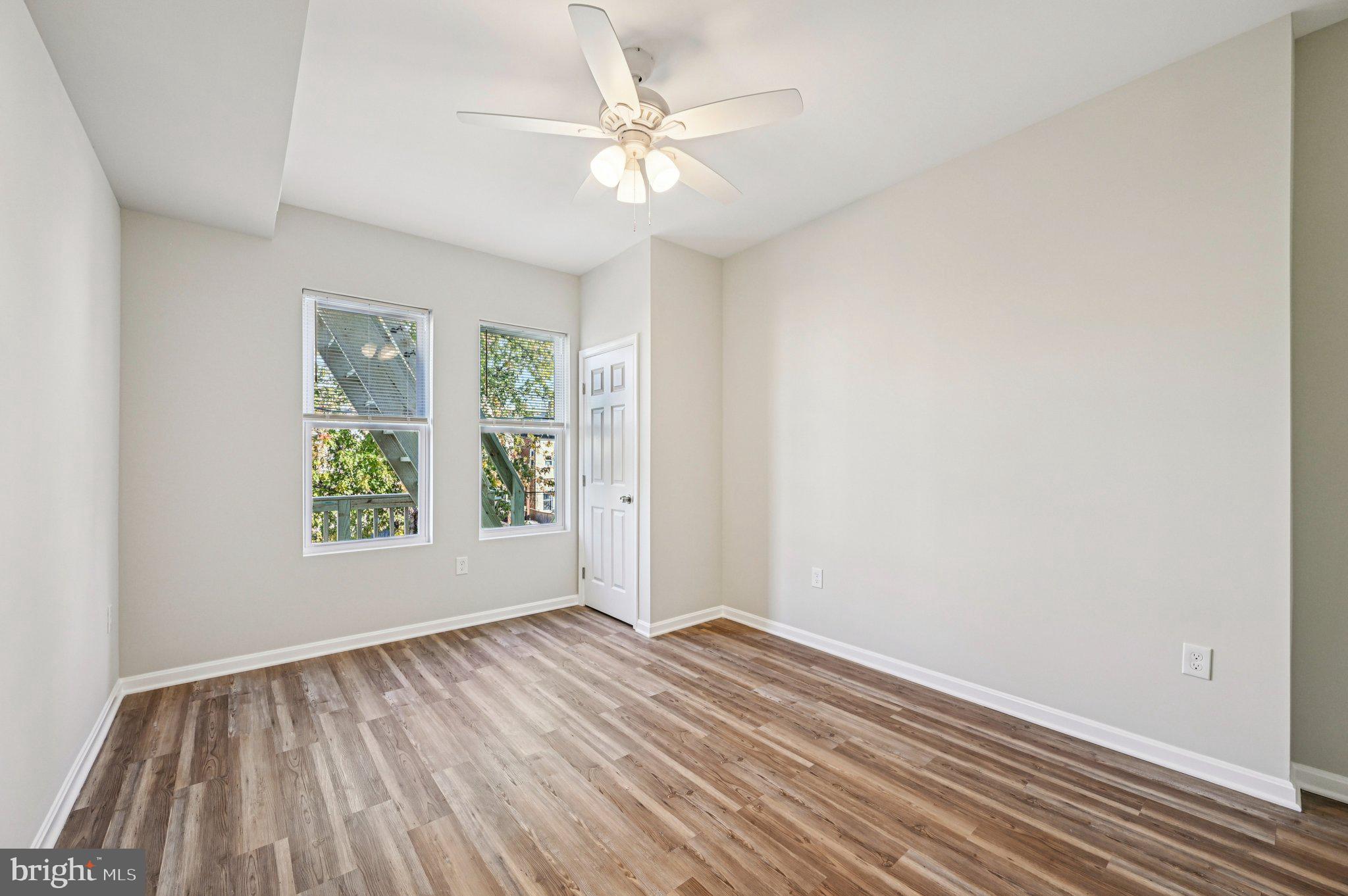 750 Reservoir Street, Unit B Baltimore, MD 21217 - Photo 17 of 25 wooden floor in an empty room with a window