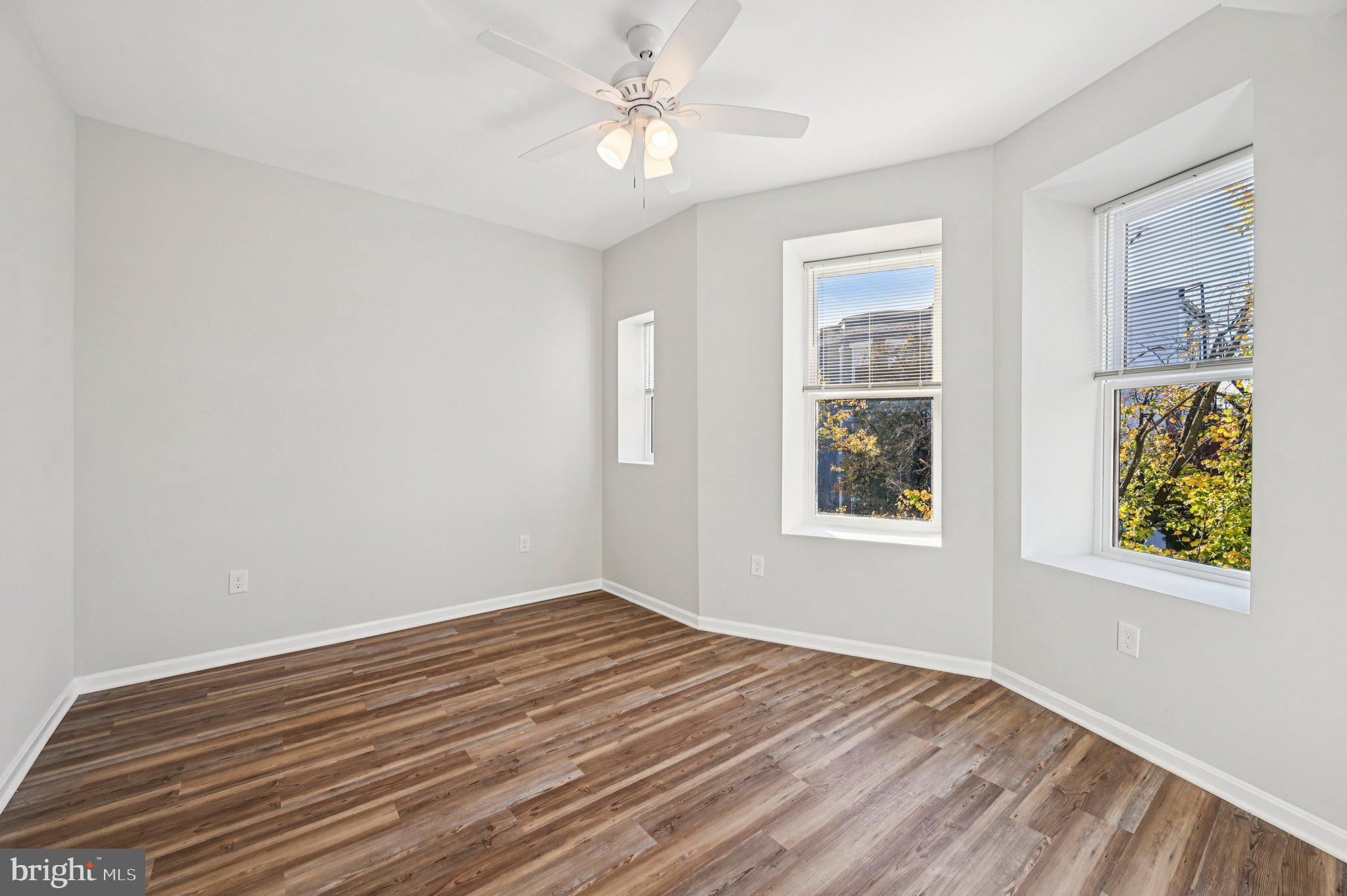 750 Reservoir Street, Unit B Baltimore, MD 21217 - Photo 23 of 25 a view of room with window and ceiling fan