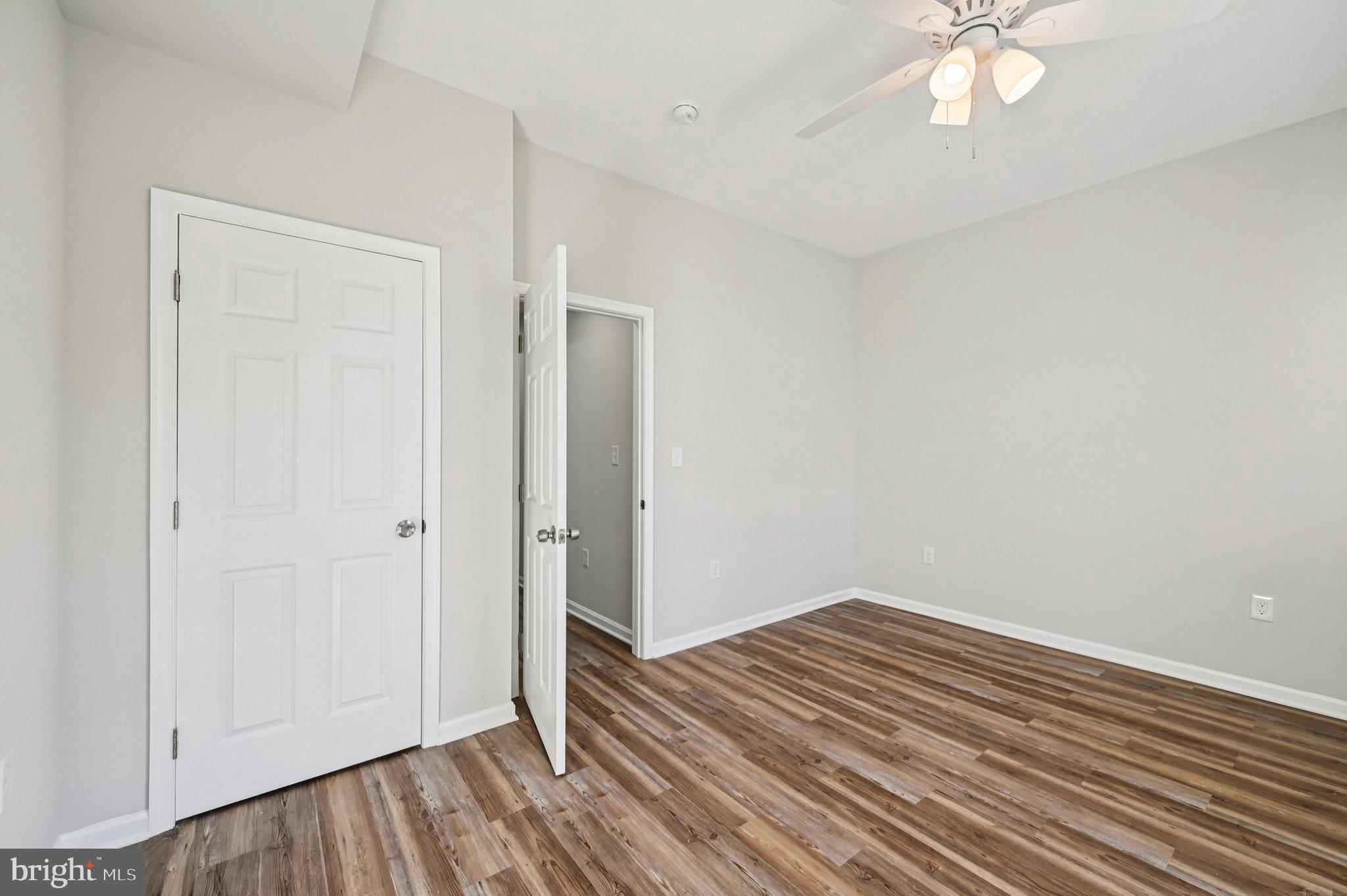750 Reservoir Street, Unit B Baltimore, MD 21217 - Photo 24 of 25 wooden floor in an empty room with a window