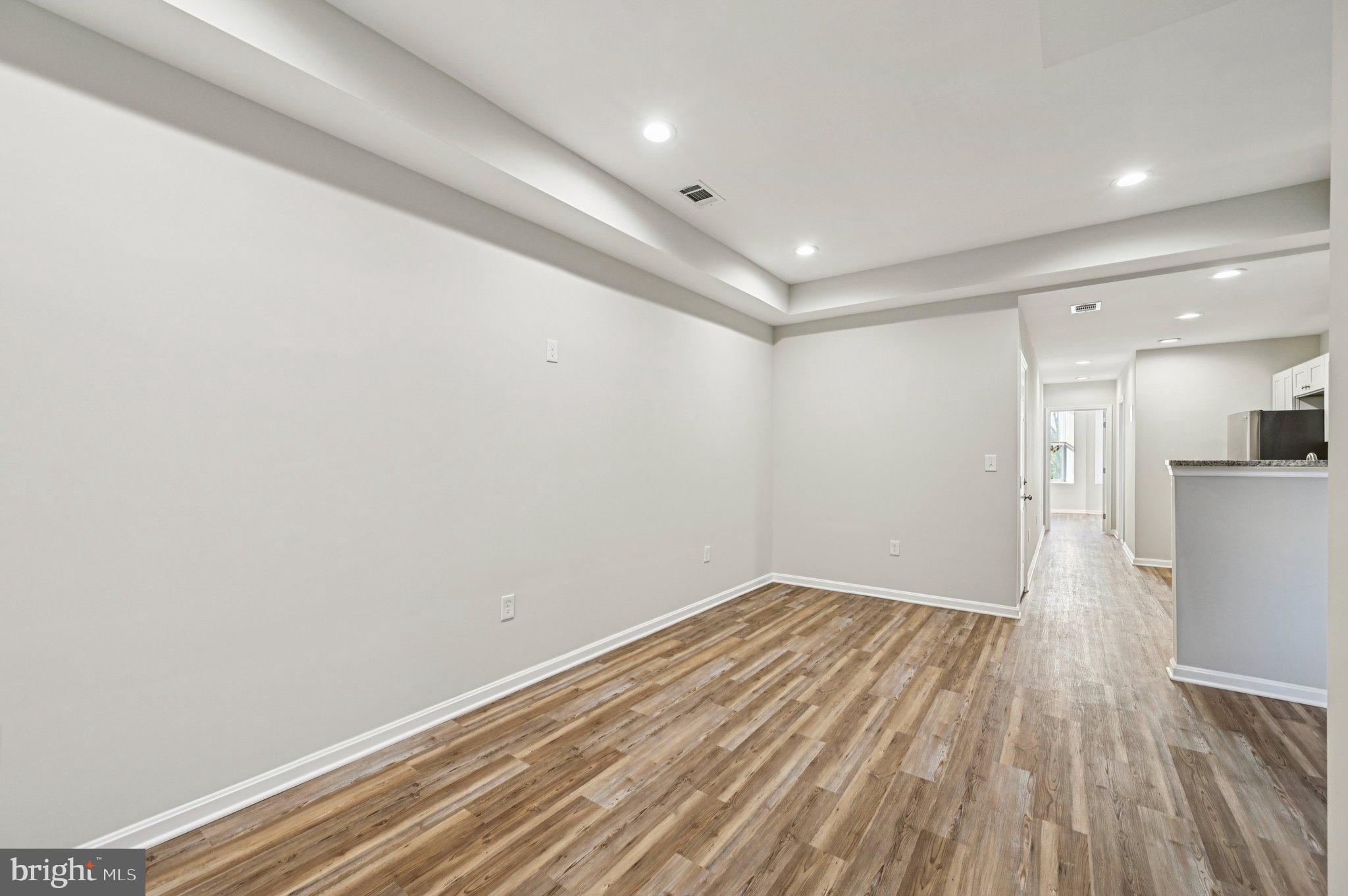 750 Reservoir Street, Unit B Baltimore, MD 21217 - Photo 9 of 25 a view of empty room with wooden floor