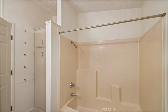 a bathroom with a glass shower door