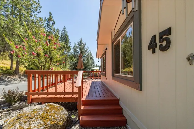 a view of balcony with wooden floor and outdoor seating