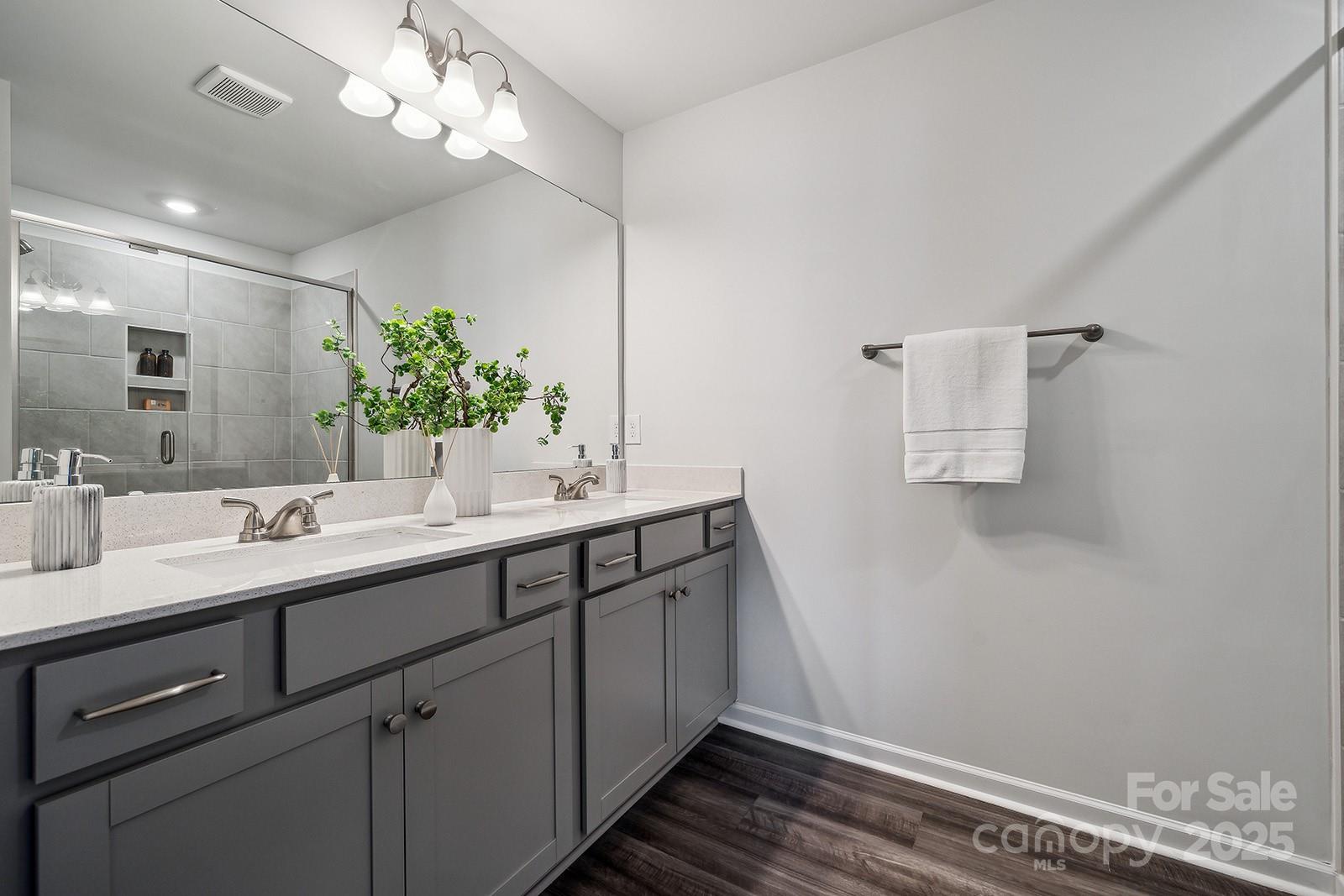4738 Lakeview Road, Unit 16 Charlotte, NC 28216 - Photo 18 of 24 a bathroom with a sink and a mirror