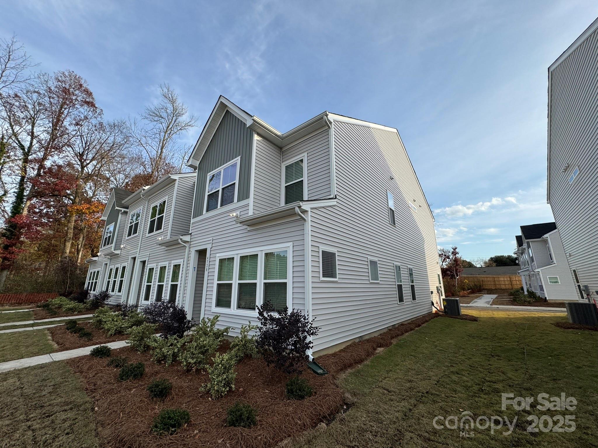 4738 Lakeview Road, Unit 16 Charlotte, NC 28216 - Photo 2 of 24 a view of a house with a yard