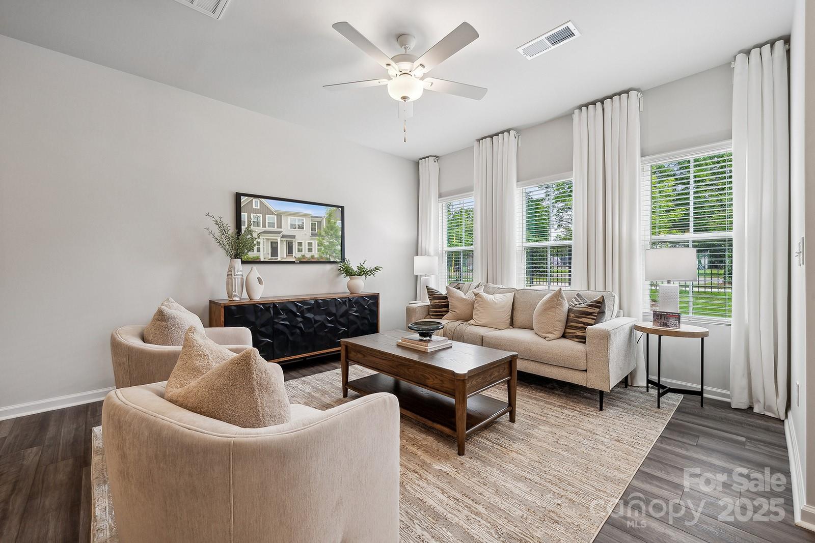 4738 Lakeview Road, Unit 16 Charlotte, NC 28216 - Photo 7 of 24 a living room with furniture and large windows
