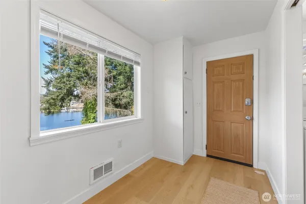 a view of an empty room with a window