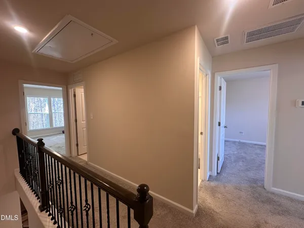 a view of a hallway with windows