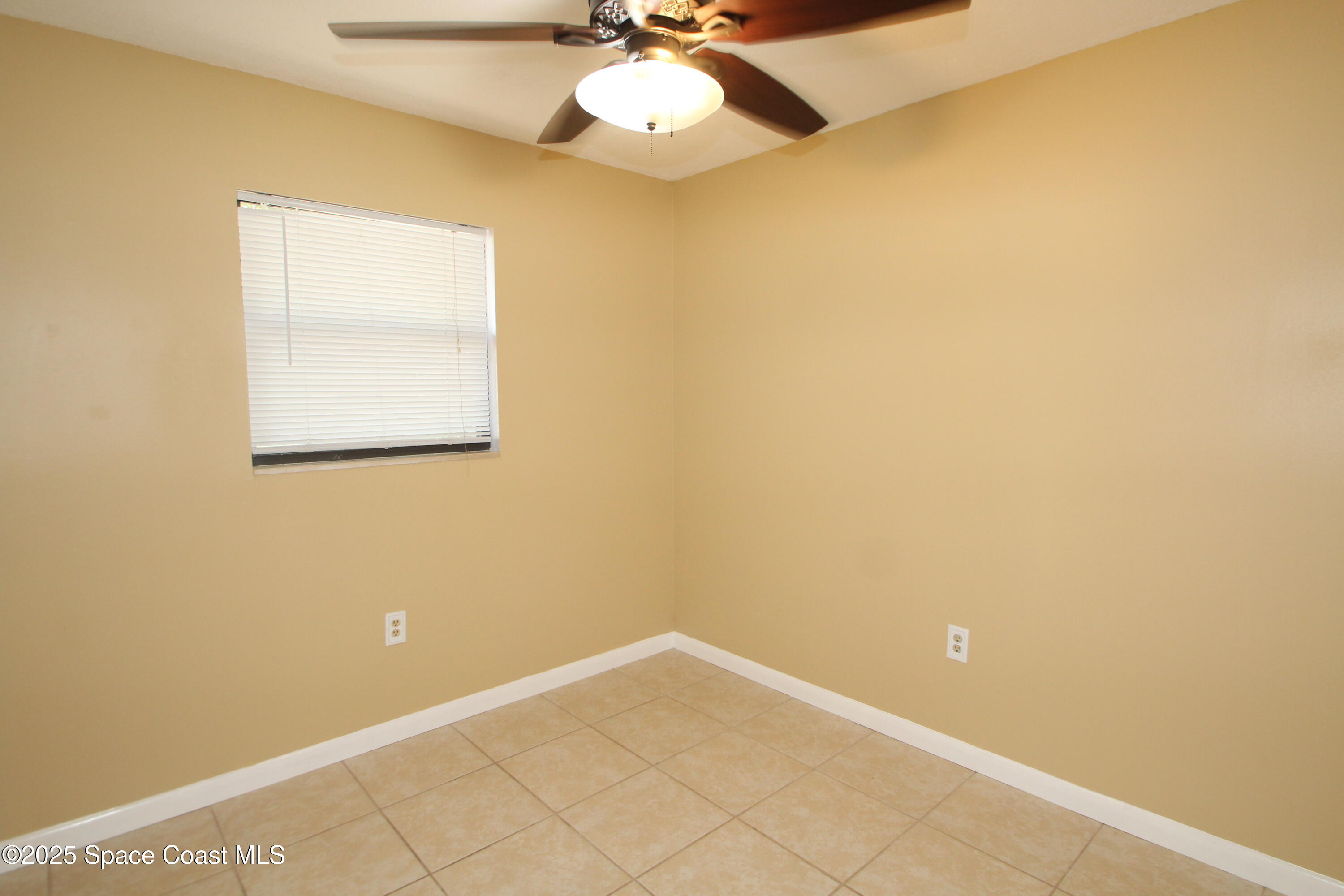 165 Virginia Road Melbourne, FL 32904 - Photo 15 of 32 an empty room with a window