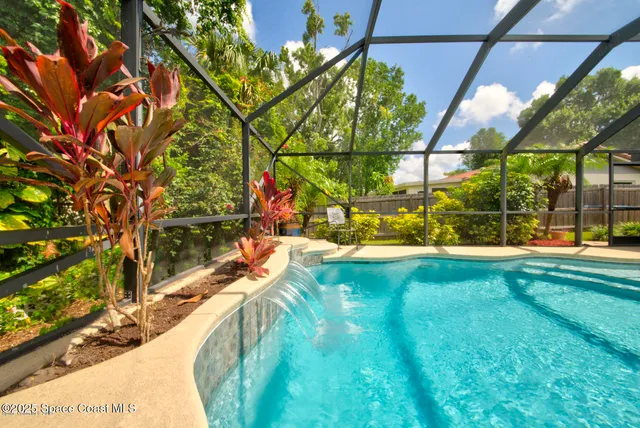 a swimming pool with outdoor seating and yard
