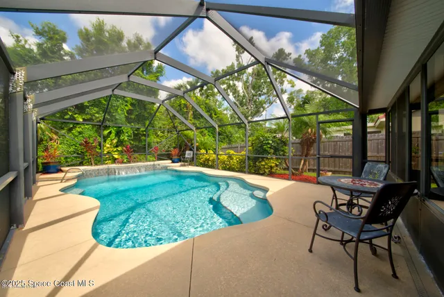 a view of a swimming pool with a patio