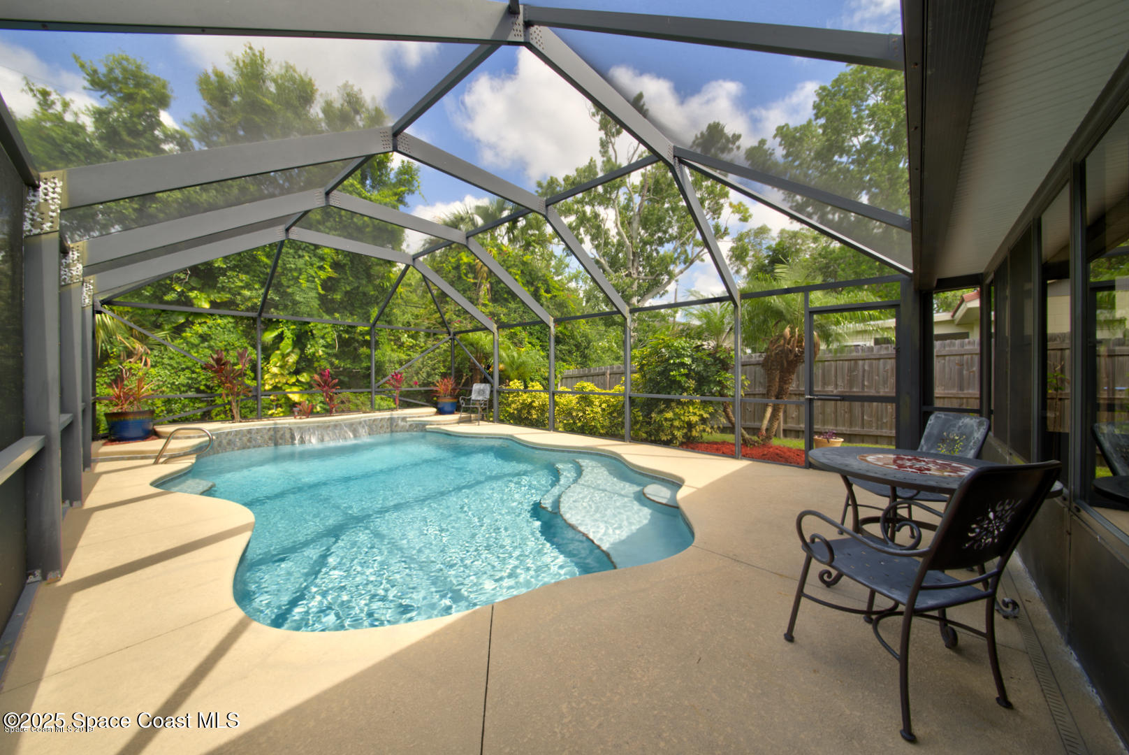 165 Virginia Road Melbourne, FL 32904 - Photo 23 of 32 a swimming pool with outdoor seating and yard