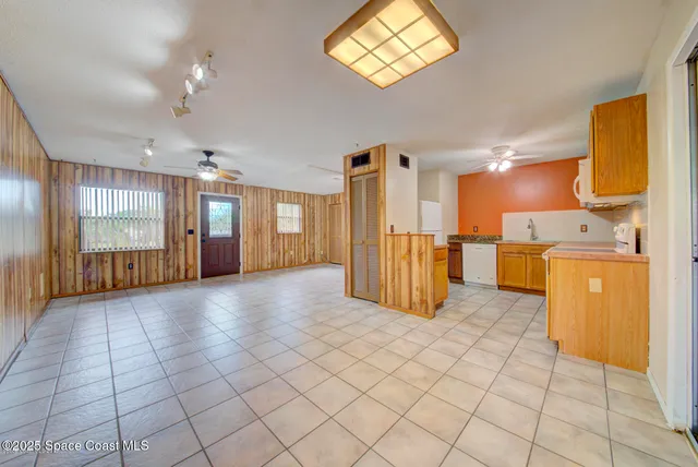 a kitchen with granite countertop cabinets stainless steel appliances and wooden cabinets