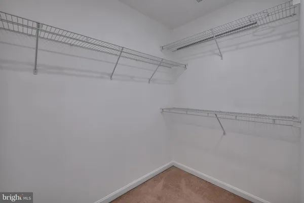 a view of a room with racks on the wall
