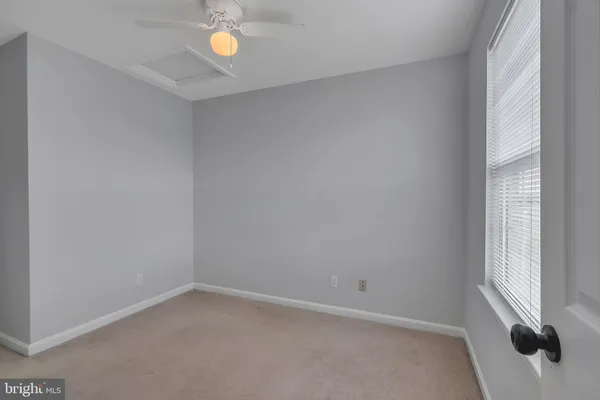 a view of an empty room and window