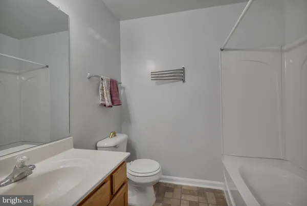 a bathroom with a sink toilet and vanity