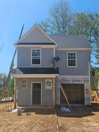 a front view of a house with yard