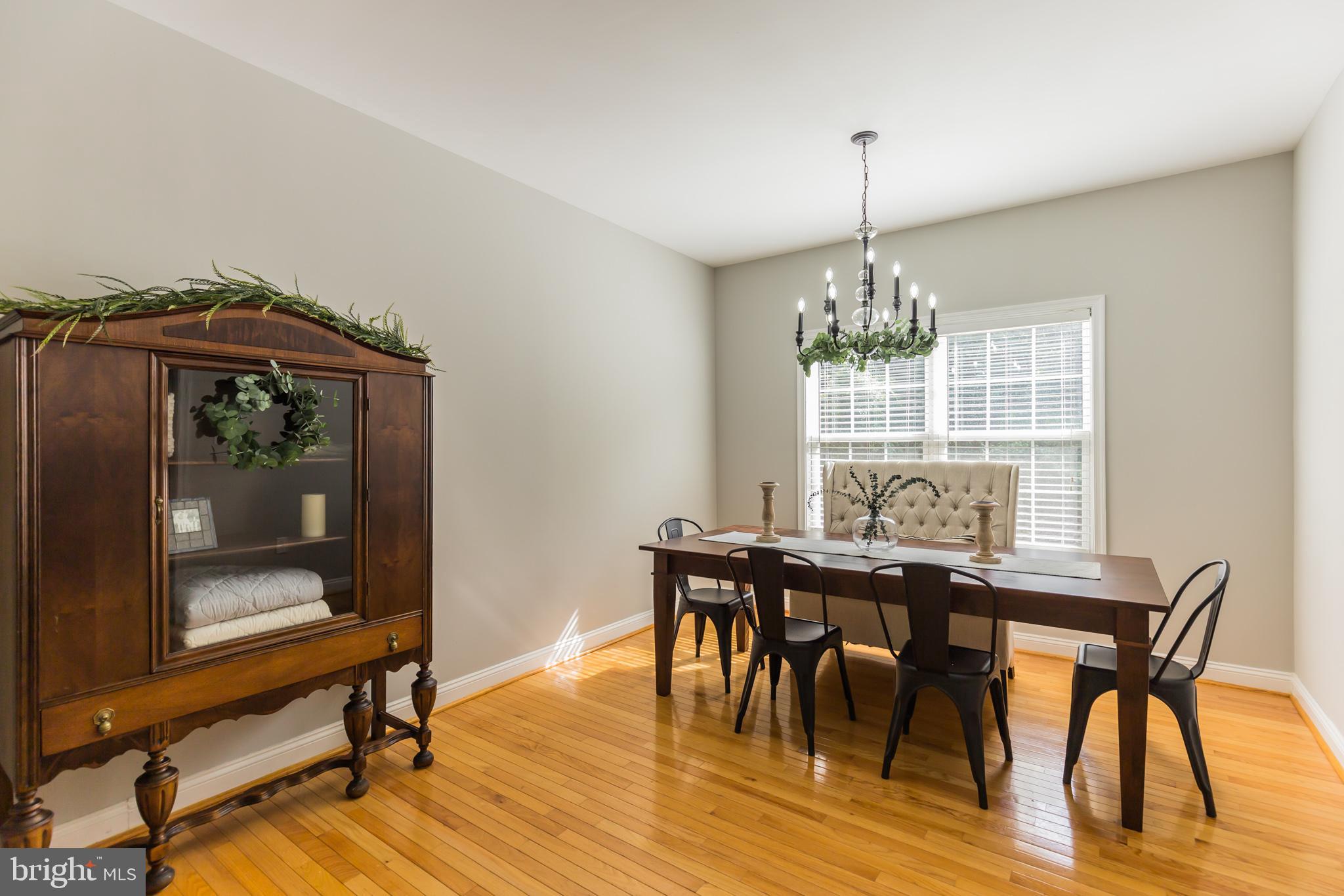 11598 Big Sandy Run Road Lusby, MD 20657 - Photo 12 of 30 a view of a dining room with furniture window and wooden floor