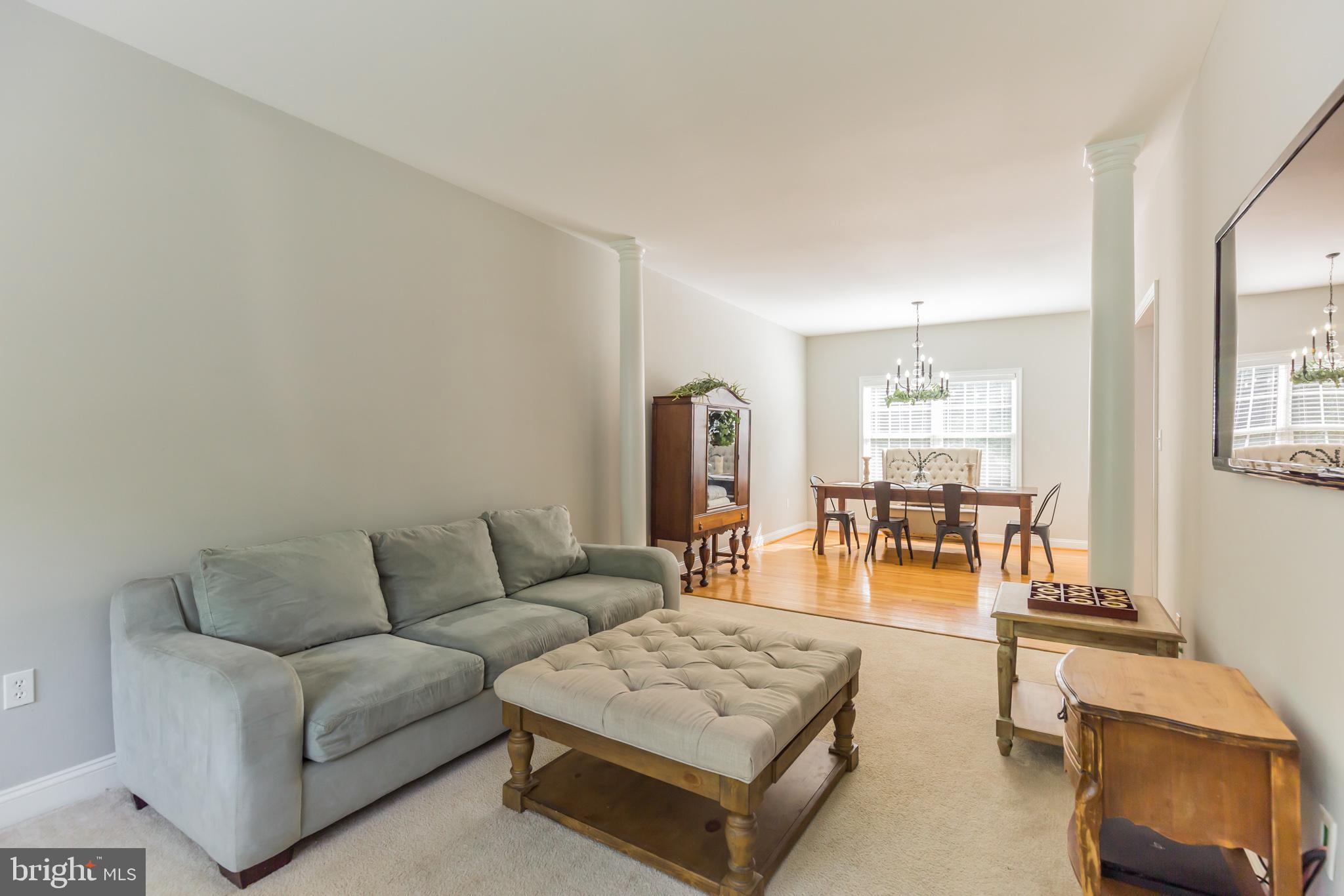 11598 Big Sandy Run Road Lusby, MD 20657 - Photo 15 of 30 a living room with furniture and wooden floor