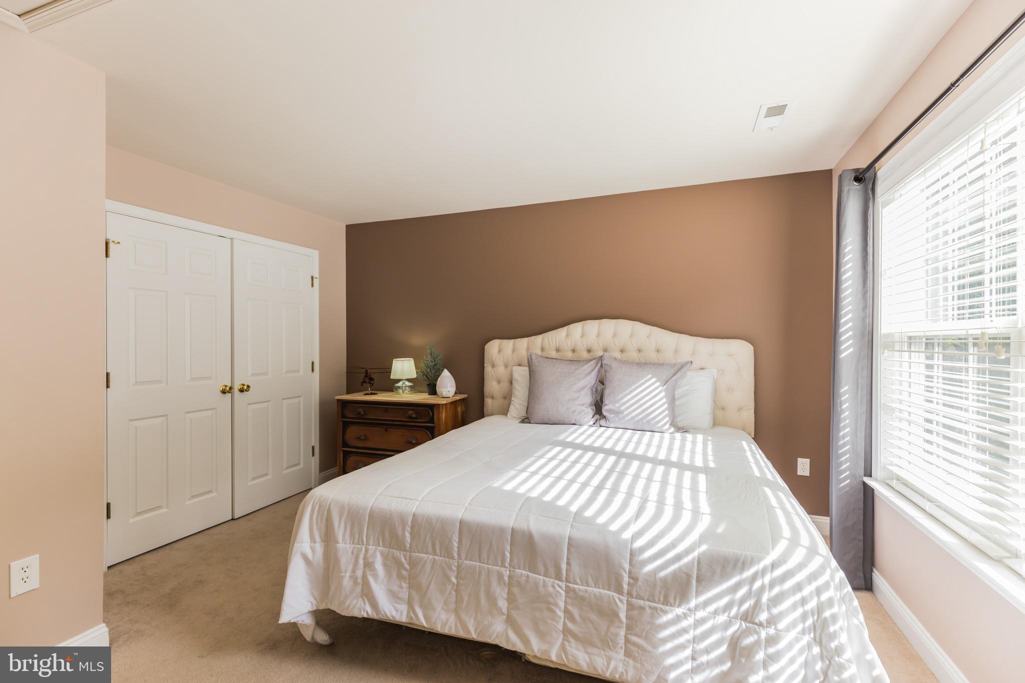 11598 Big Sandy Run Road Lusby, MD 20657 - Photo 18 of 30 a bedroom with a bed and a window