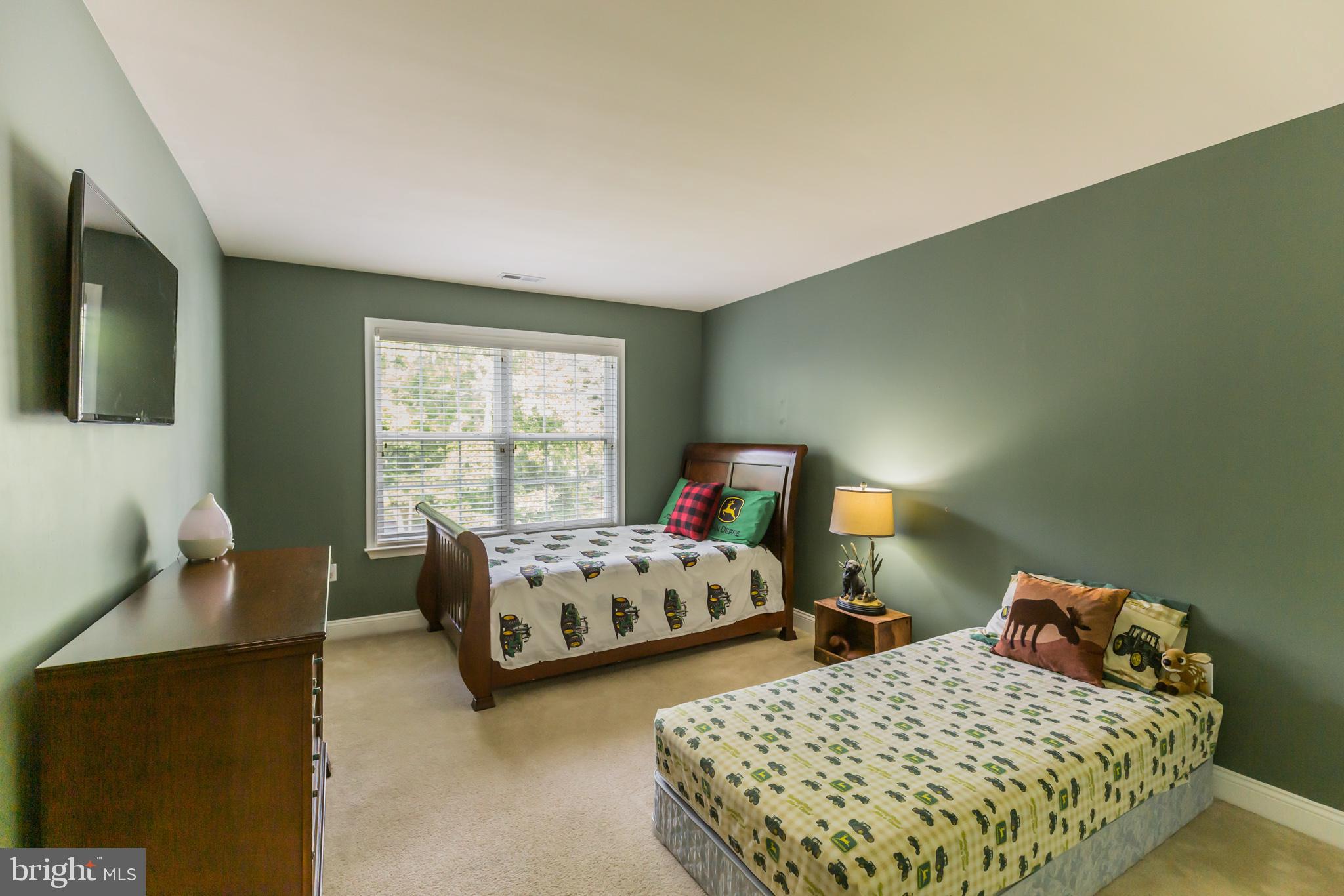 11598 Big Sandy Run Road Lusby, MD 20657 - Photo 19 of 30 a bedroom with two beds and a window