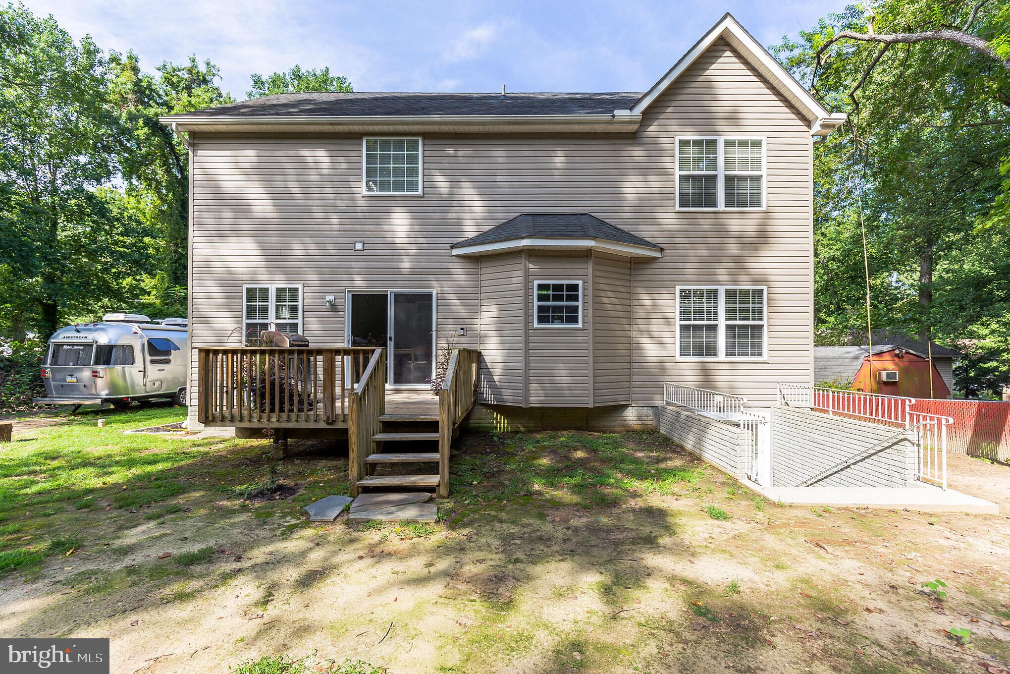 11598 Big Sandy Run Road Lusby, MD 20657 - Photo 28 of 30 a front view of a house with a yard