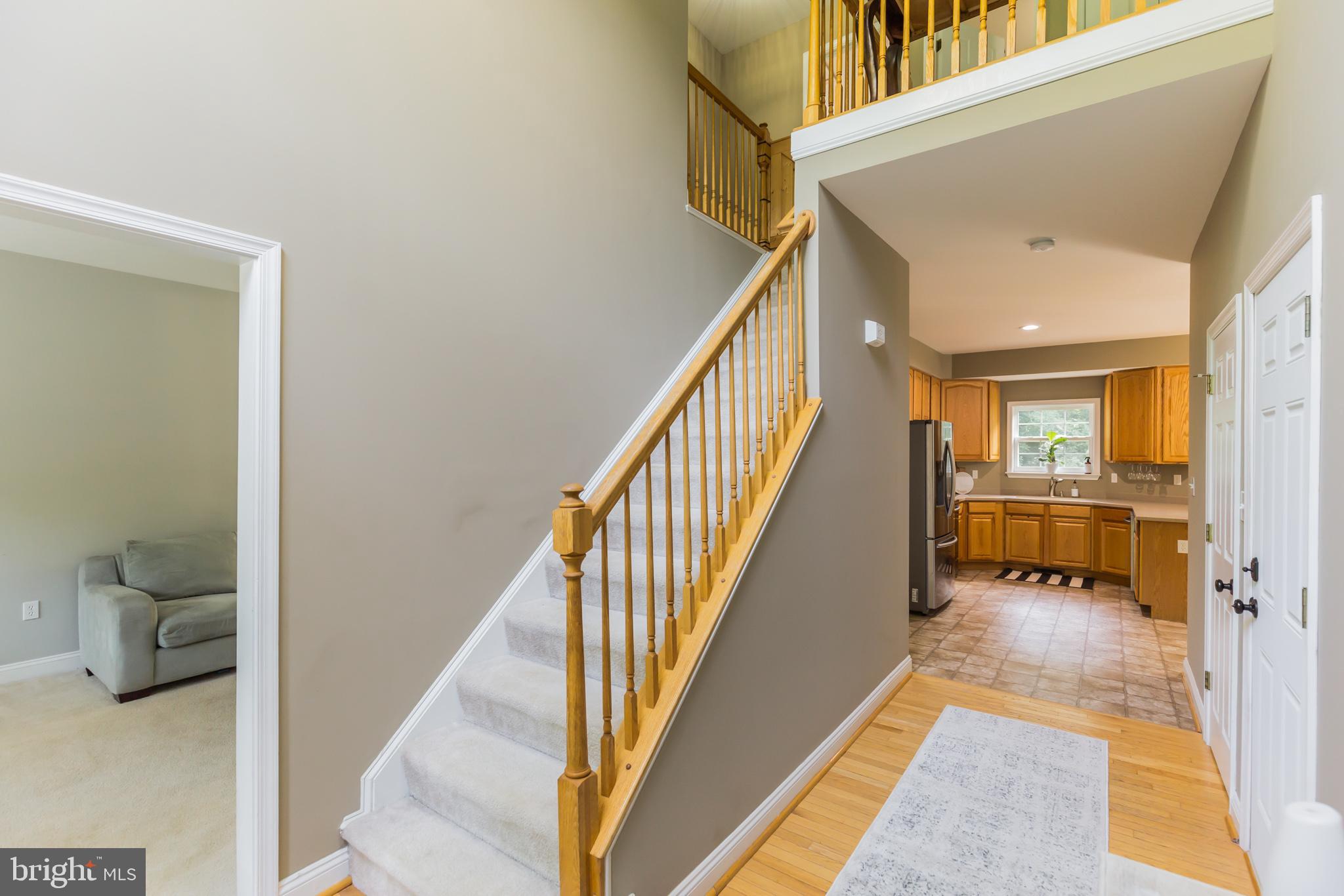 11598 Big Sandy Run Road Lusby, MD 20657 - Photo 4 of 30 a view of a hallway with furniture and staircase