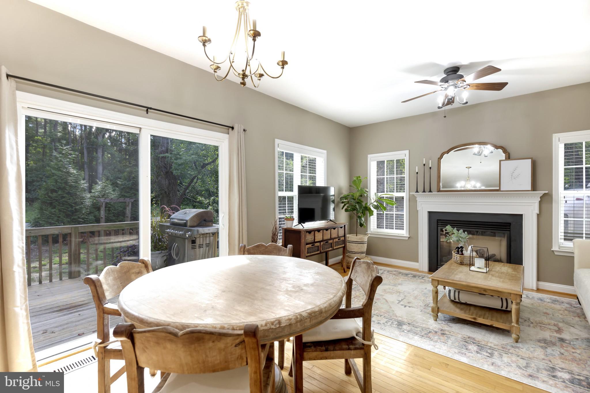 11598 Big Sandy Run Road Lusby, MD 20657 - Photo 7 of 30 a view of a dining room with furniture window and wooden floor