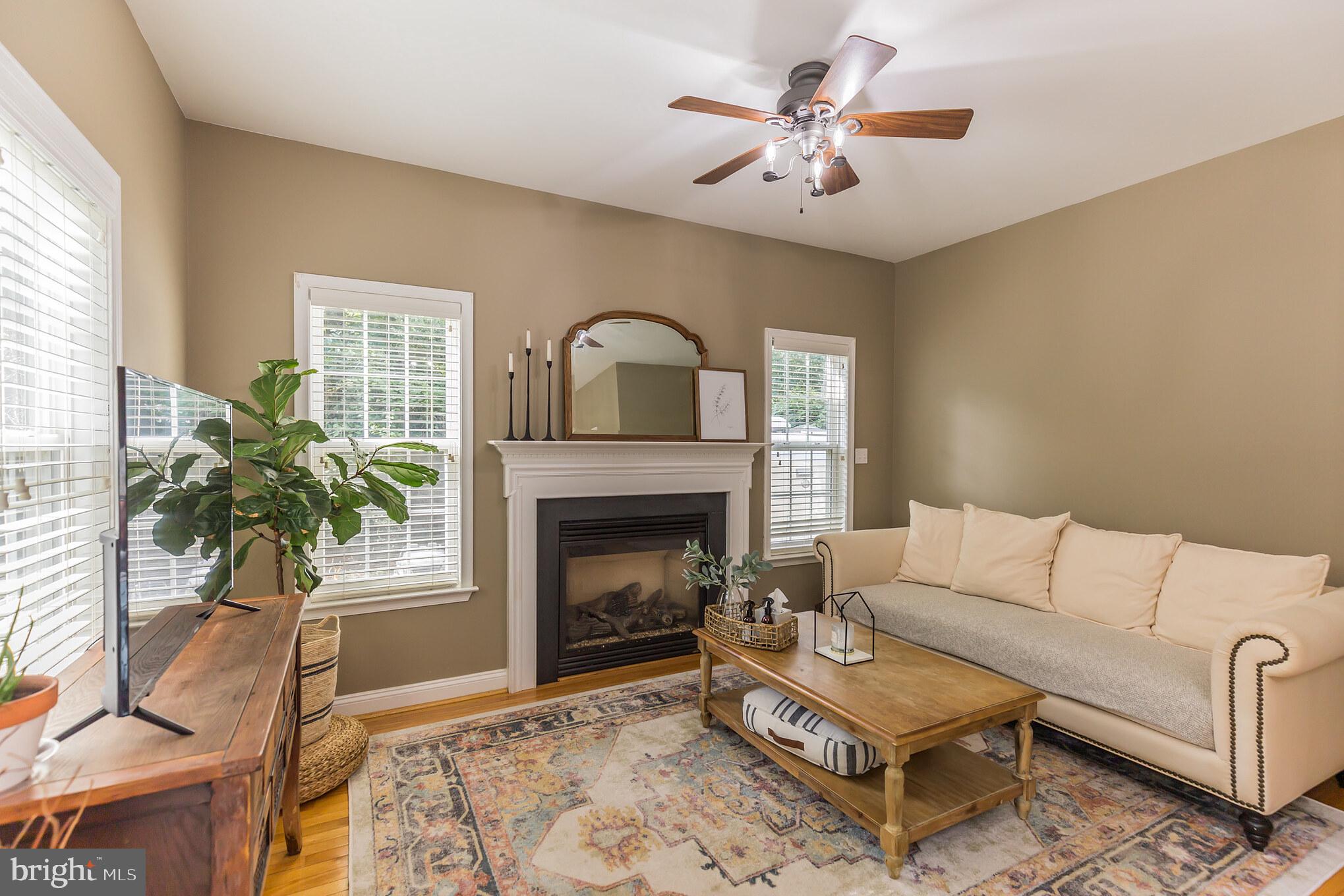 11598 Big Sandy Run Road Lusby, MD 20657 - Photo 8 of 30 a living room with furniture and a fireplace
