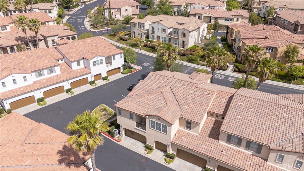 20335 Paseo Meriana Porter Ranch, CA 91326 - Photo 49 of 58 Aerial View of Well-Maintained Exterior with Garage Entry and Driveway